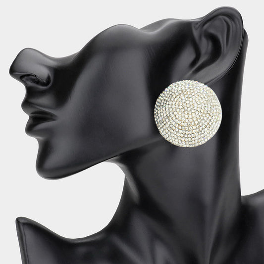 A clip-on evening earring featuring a round, rhinestone pave design, displayed on a black mannequin head.
