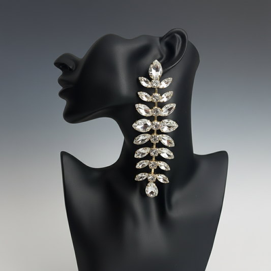 silver long elegant Earring on a black mannequin head with a gray background