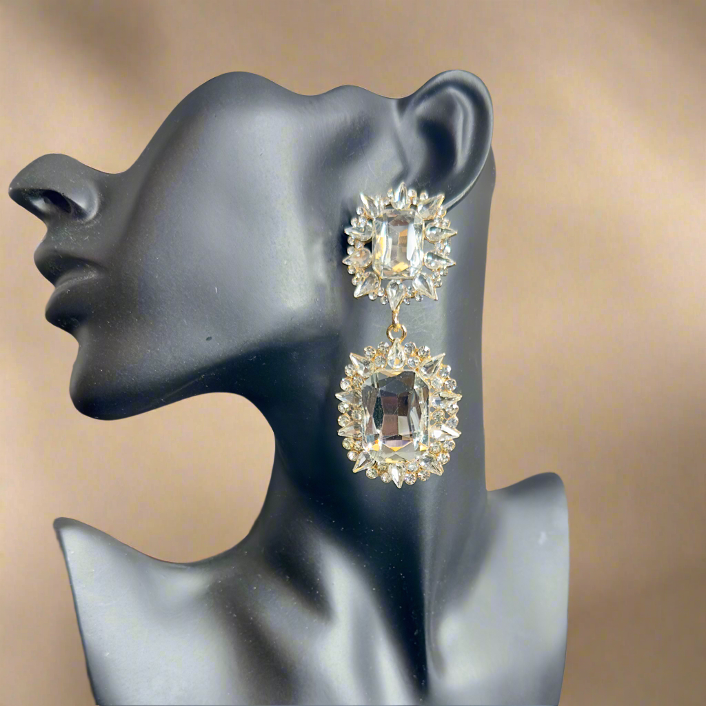crystal Earring on a mannequin head with a beige background