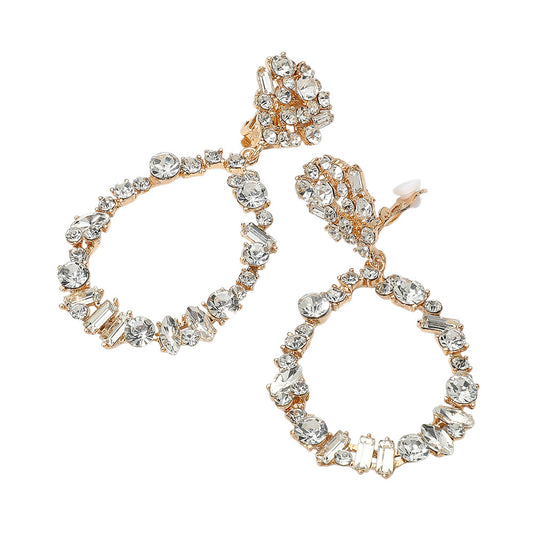 Pair of gold and crystal earrings on a white background