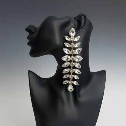 silver long elegant Earring on a black mannequin head with a gray background