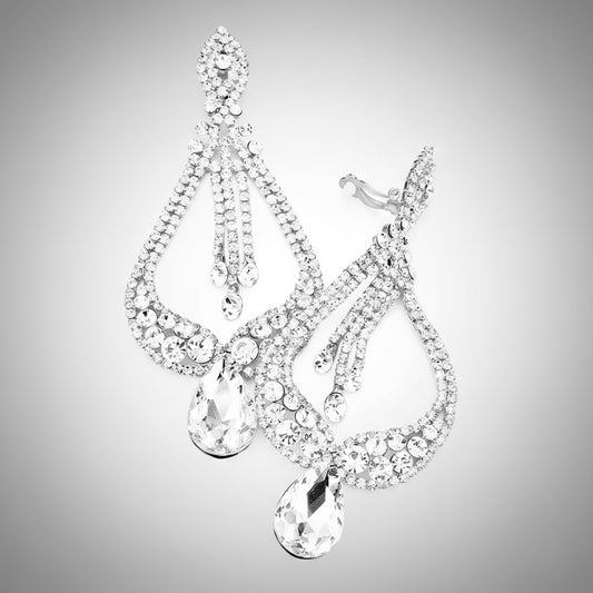 Pair of silver earrings with clear gemstones on a gray background