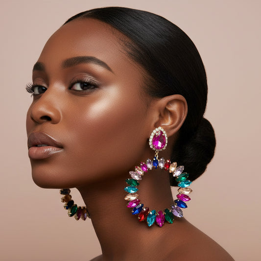 Model Multicolored gemstone earrings on a blush background